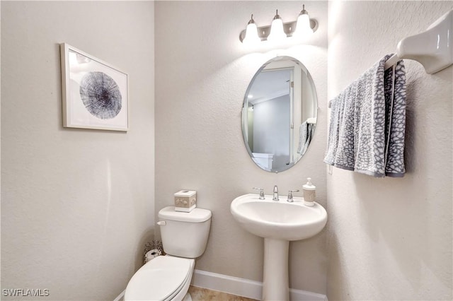 bathroom with sink and toilet