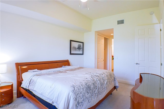 bedroom with ceiling fan and light colored carpet