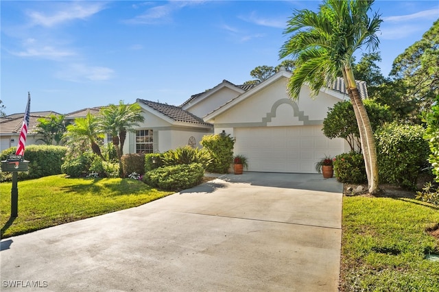 view of front of house featuring a front yard and a garage