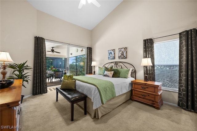 carpeted bedroom with ceiling fan, access to exterior, and vaulted ceiling