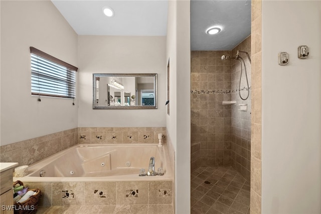 bathroom with vanity and separate shower and tub