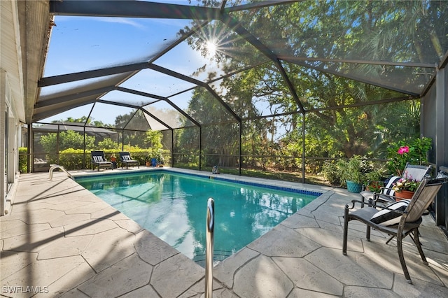 view of pool featuring a lanai and a patio