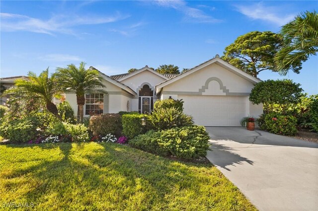 single story home featuring a front lawn and a garage