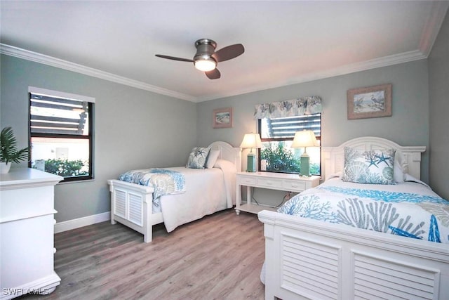 bedroom featuring hardwood / wood-style floors, ceiling fan, and ornamental molding