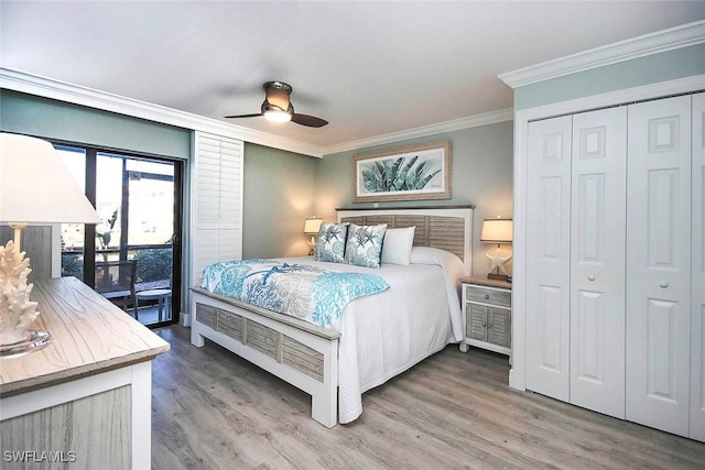 bedroom with ornamental molding, access to outside, ceiling fan, hardwood / wood-style flooring, and a closet