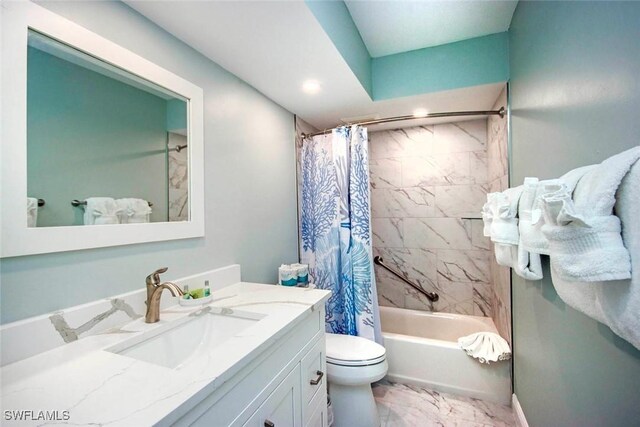 full bathroom with shower / bath combination with curtain, vanity, and toilet