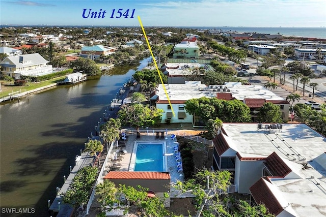 birds eye view of property featuring a water view