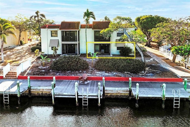 back of house with a water view