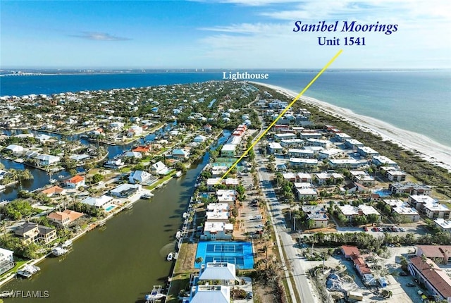 drone / aerial view featuring a view of the beach and a water view