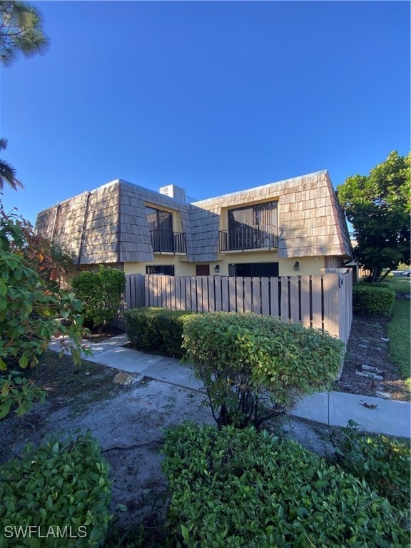 view of property exterior featuring a balcony