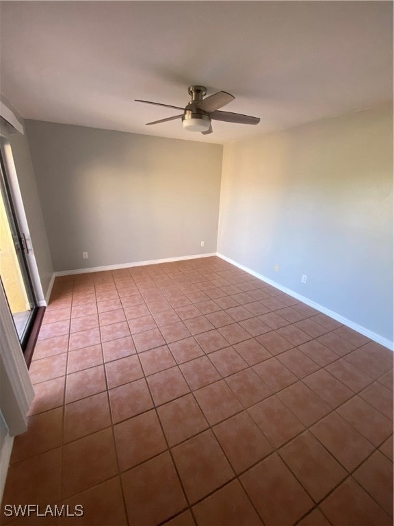 tiled empty room with ceiling fan