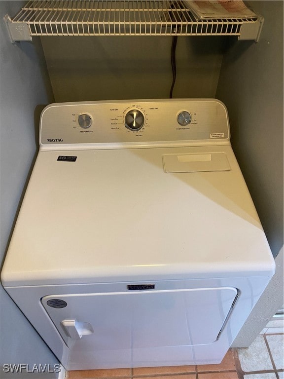 laundry room featuring washer / dryer and tile patterned floors