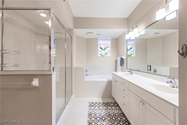 bathroom featuring tile patterned flooring, vanity, and independent shower and bath