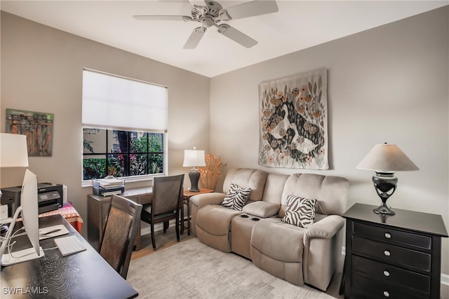 living room featuring ceiling fan and light wood-type flooring