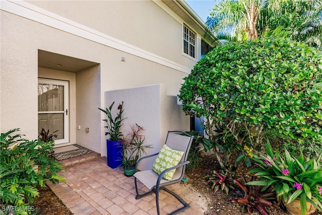 property entrance with a patio area