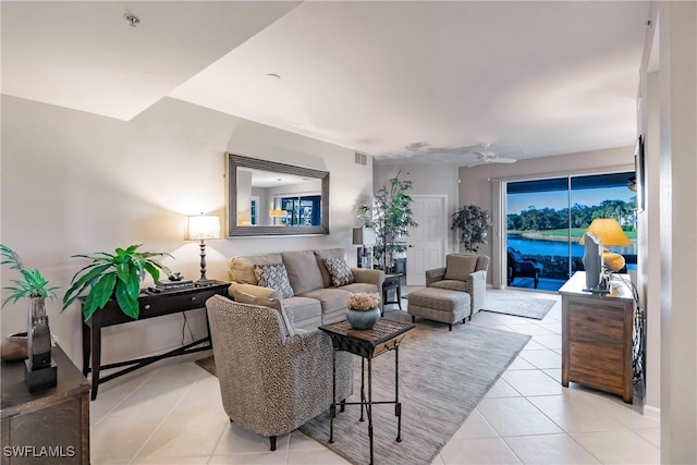 tiled living room featuring ceiling fan