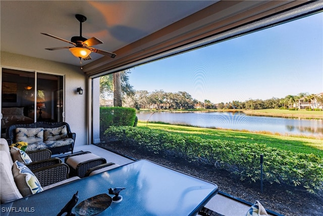 view of patio / terrace with an outdoor hangout area, a water view, and ceiling fan