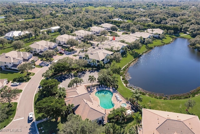 birds eye view of property with a water view