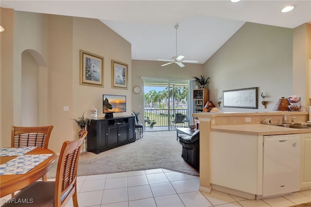 living room with ceiling fan, high vaulted ceiling, and light colored carpet