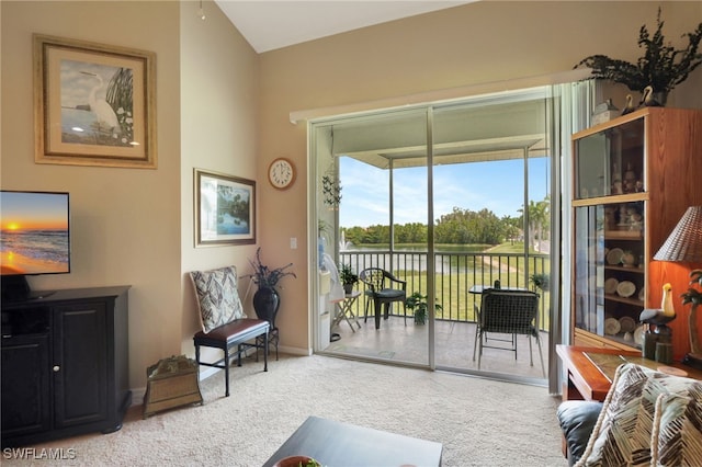 interior space with carpet and a water view