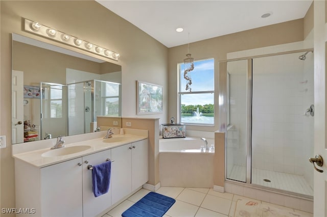 bathroom with tile patterned floors, vanity, and plus walk in shower