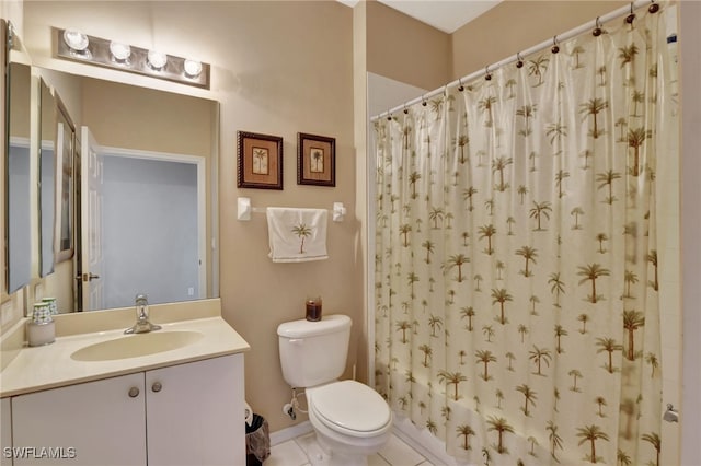 bathroom with tile patterned floors, vanity, and toilet