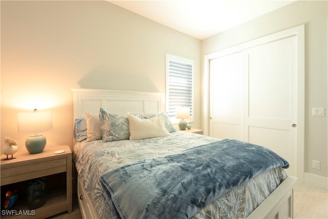 14248 Laguna Springs Ln, Naples, FL 34114 - carpeted bedroom with a closet and baseboards