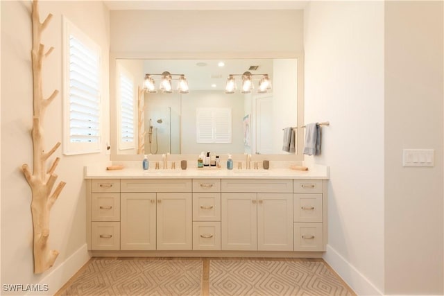 14248 Laguna Springs Ln, Naples, FL 34114 - bathroom with baseboards, double vanity, and a shower