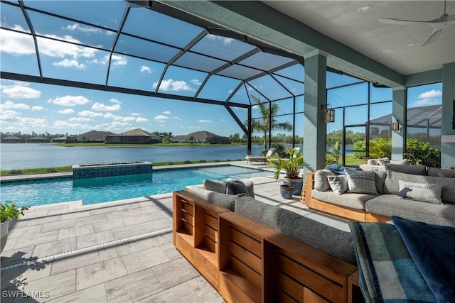 14248 Laguna Springs Ln, Naples, FL 34114 - swimming pool featuring an outdoor hangout area, a patio area, ceiling fan, glass enclosure, and a water view