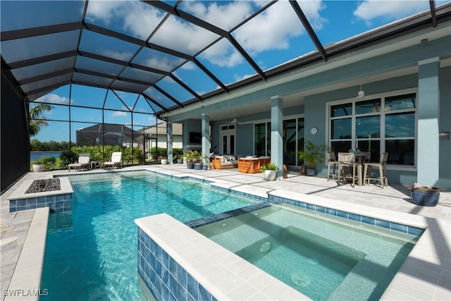 14248 Laguna Springs Ln, Naples, FL 34114 - view of swimming pool featuring a patio, a pool with connected hot tub, a ceiling fan, and a lanai