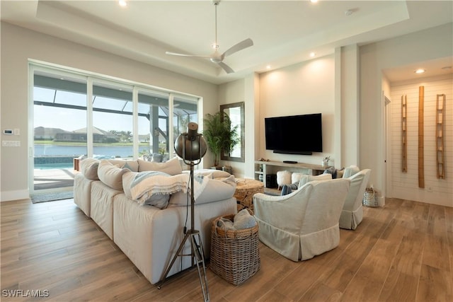 14248 Laguna Springs Ln, Naples, FL 34114 - living area with wood finished floors, a ceiling fan, and recessed lighting