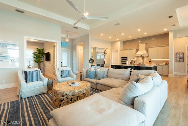 14248 Laguna Springs Ln, Naples, FL 34114 - living room with ceiling fan, light wood-type flooring, baseboards, and recessed lighting