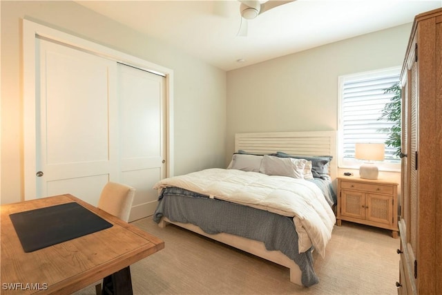 14248 Laguna Springs Ln, Naples, FL 34114 - bedroom with a closet, light colored carpet, and ceiling fan