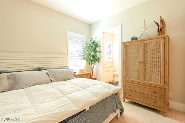 14248 Laguna Springs Ln, Naples, FL 34114 - bedroom with light colored carpet and ensuite bath