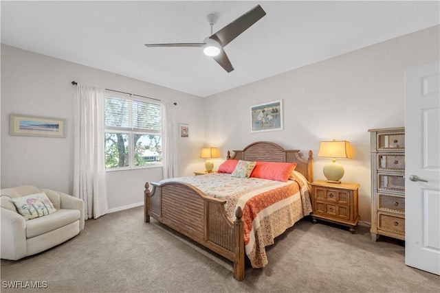 carpeted bedroom featuring a ceiling fan and baseboards