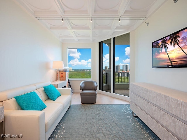 bedroom with beam ceiling, access to exterior, and coffered ceiling