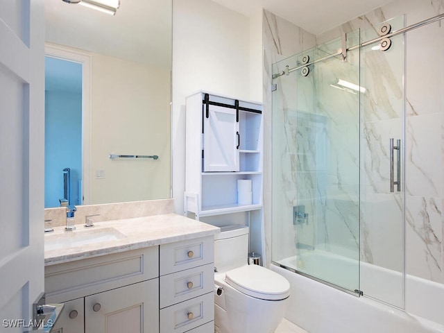 full bathroom with shower / bath combination with glass door, vanity, and toilet