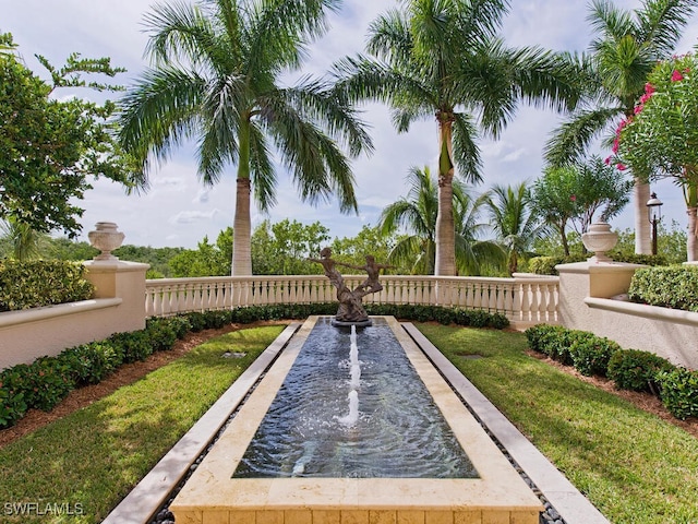 view of home's community with a lawn