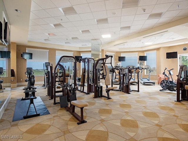 workout area featuring a paneled ceiling