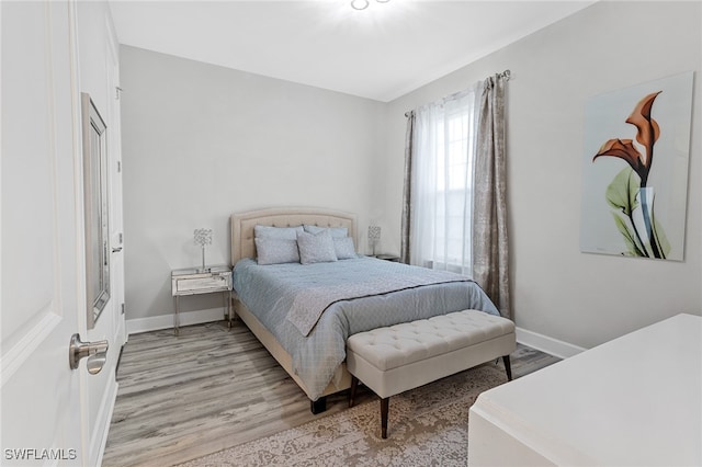 bedroom featuring light wood-type flooring