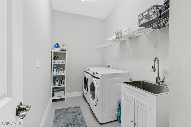 laundry area with washer and dryer and sink