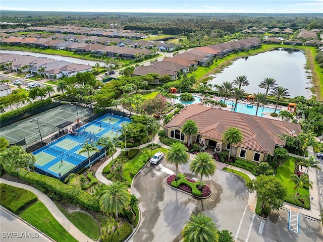 birds eye view of property with a water view