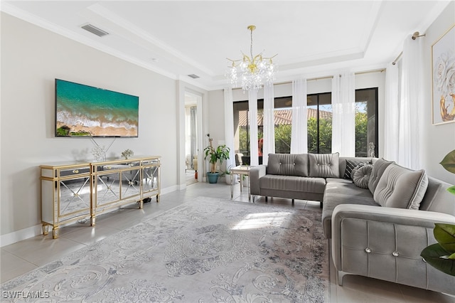 tiled living room with a tray ceiling, crown molding, and a notable chandelier