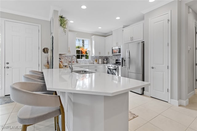 kitchen featuring light tile patterned flooring, appliances with stainless steel finishes, backsplash, and sink