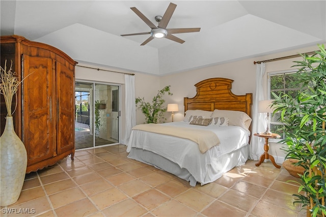 tiled bedroom featuring access to outside, vaulted ceiling, multiple windows, and ceiling fan