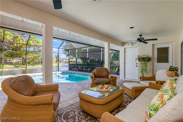 exterior space with tile patterned floors, ceiling fan, and a water view