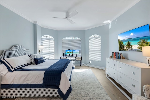 bedroom with ceiling fan, light hardwood / wood-style floors, and crown molding