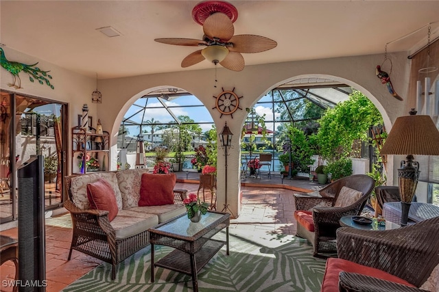 sunroom / solarium featuring ceiling fan and a healthy amount of sunlight