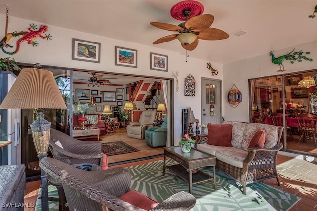 living room with hardwood / wood-style flooring and ceiling fan