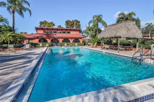 view of swimming pool with a gazebo and a patio